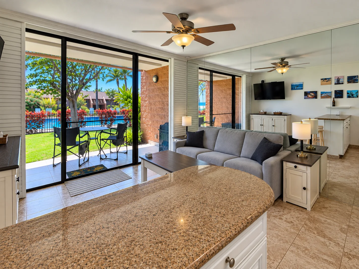 Living room opening toward lanai and pool